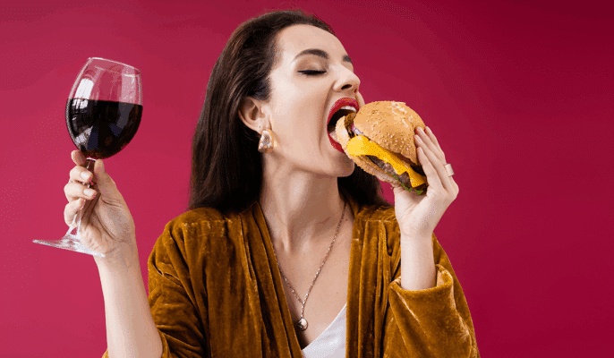 drinking wine and eating junk food